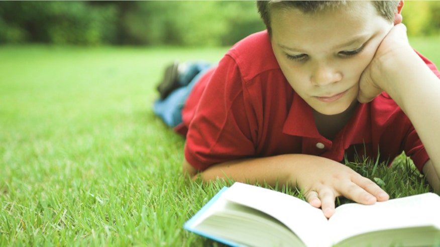 Boy reading book_istock.jpg